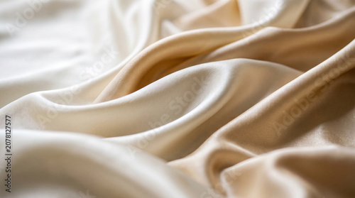 Photos Premium white silk satin fabric waves texture, smooth elegant flowing cloth back