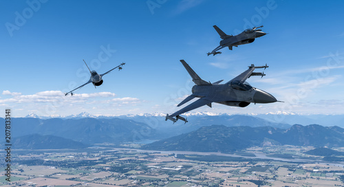 Quadro su tela Three Fighter Jets Flying in Formation Over Mountain Valley — Military Jet Air P