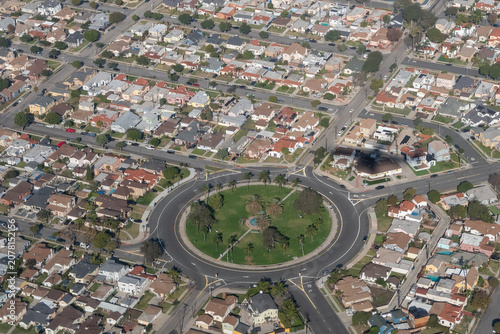 Aerial view of Circle Park, a landscaped traffic circle with palm trees and a central fountain, surrounded by residential neighborhoods in Inglewood, California, USA.