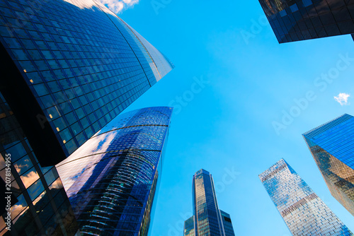Canvas Print Towering skyscrapers pierce the colorful twilight sky