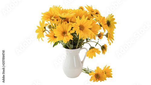 Tableau sur toile White ceramic pitcher vase filled with bright yellow wildflowers isolated on tra
