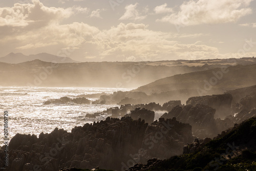 Obraz na płótnie magnificent coastline and waves in early morning light, DeKelders, South Africa