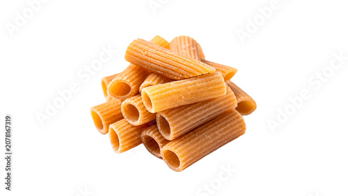 Fotografie Pile of dry golden organic rigatoni or tortiglioni pasta noodles isolated on tra