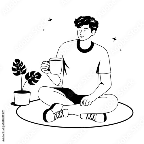 A man meditating with tea and a plant nearby.