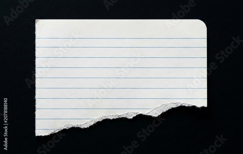 blank note paper on isolated black background