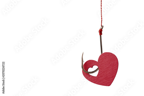 Red heart shape on a sharp fishing hook isolated on white background. Conceptual marketing bait, love trap and relationship risk banner with clear copy space.