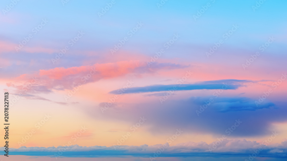 Fototapeta premium Vivid dusk sky background at sunset with calm twilight atmosphere. Beautiful pastel sky background banner visualizing peace, harmony, inspiration and tranquility.