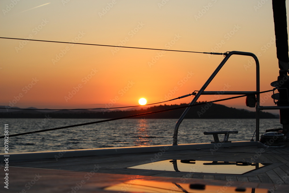 Fototapeta premium Sunset on a sailboat