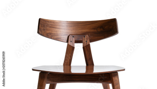 Quadro su tela Isolated modern dark wood dining chair with elegant curved backrest and sleek de