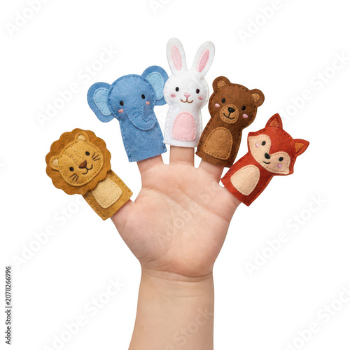 Child wearing colorful animal finger puppets isolated on a transparent background