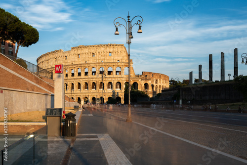 Via dei Fori Imperiali, the Colosseo Metro Station and the Colosseum in the background on a summer day in Rome, Italy	