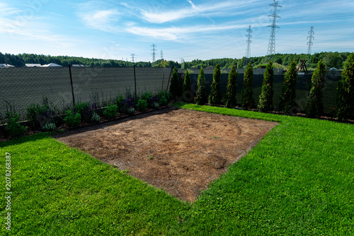 Obraz na płótnie Backyard garden showing damaged lawn after expansion pool
