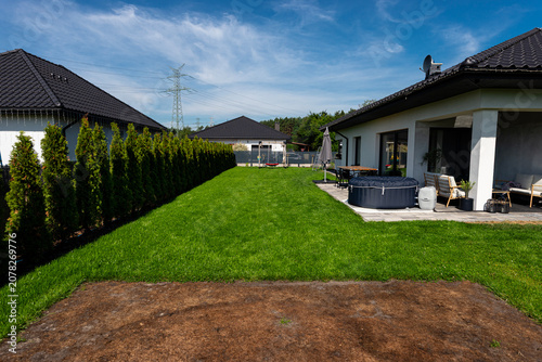 Lawn damaged from inflatable pool showing brown grass
