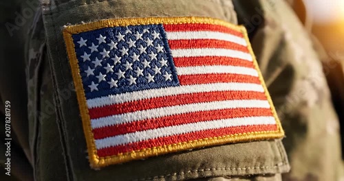 Close-up of American flag patch on a military camouflage uniform sleeve