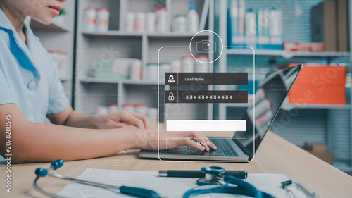 Secure healthcare login interface over a doctor using a laptop in a modern clinic, representing electronic health records, cybersecurity, patient data protection, digital healthcare and telemedicine.