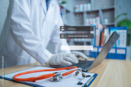 Secure healthcare login interface over a doctor using a laptop in a modern clinic, representing electronic health records, cybersecurity, patient data protection, digital healthcare and telemedicine.