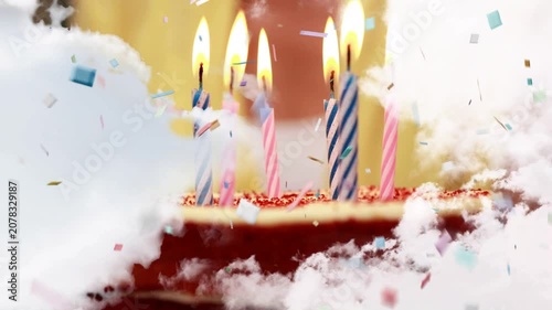 Clouds parting, blurred hand reaching with lighter, lighting striped candles on cake for party