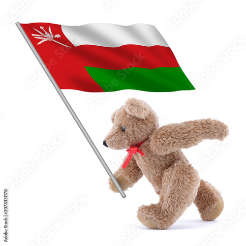An Oman flag being carried by a cute teddy bear