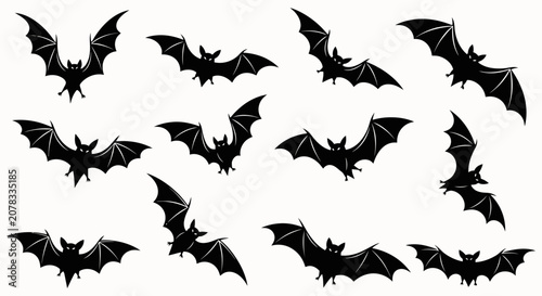 Tableau sur toile Silhouettes of Black Bats Flying in Formation.