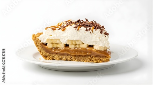 Slice of banoffee pie with caramel bananas whipped cream and chocolate shavings on a plate for bakery menu display
