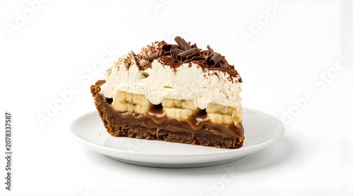 Slice of banoffee pie with fresh banana caramel cream and chocolate shavings on a plate for bakery menu dessert theme