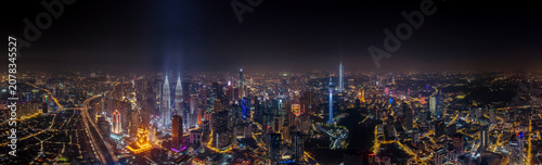 Kuala lumpur cityscape with illuminated petronas towers at night