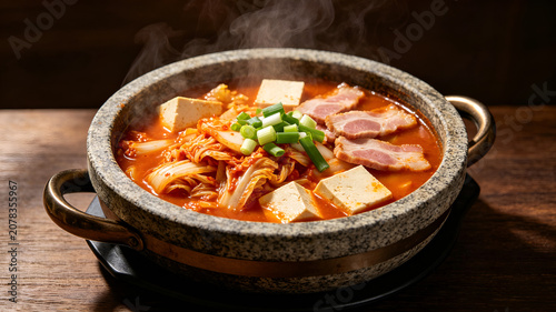 Kimchi Jjigae Korean Spicy Stew with Tofu and Pork in Hot Stone Pot
