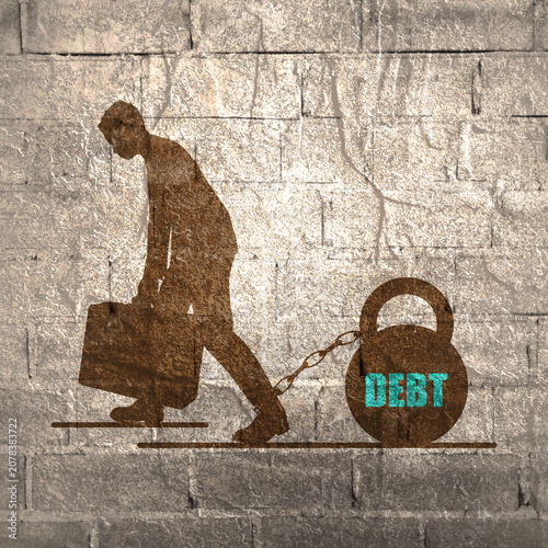 Foto Businessman chained by a huge weight debt