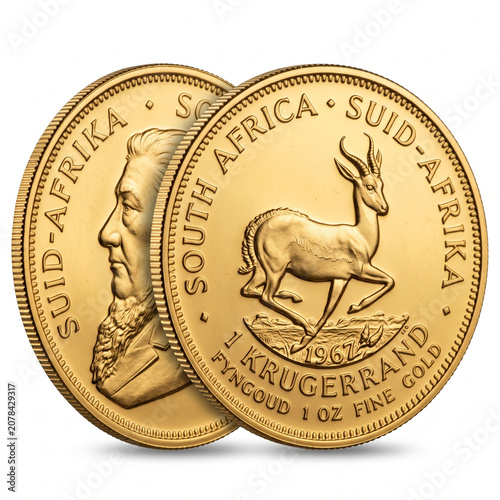 Close up of gold South Africa Krugerrand coin with springbok antelope design on reflective surface