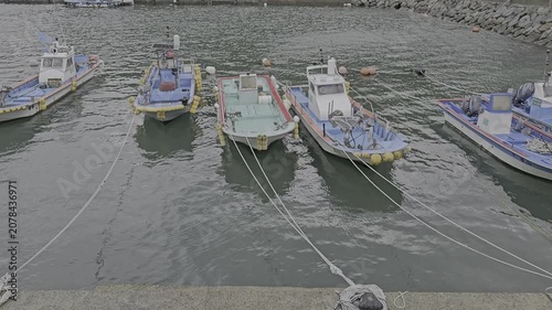 a video of fishing boats anchored at the port