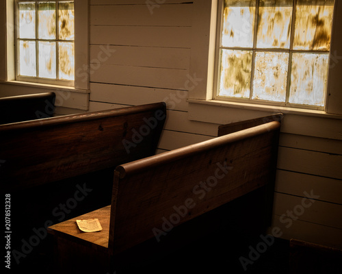 Foto Rustic chapel interior in golden morning light