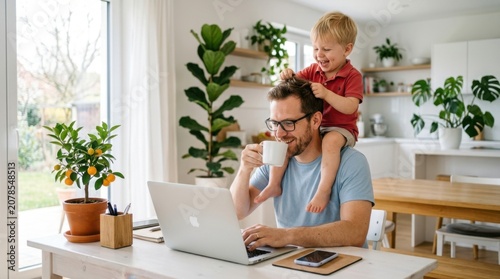 Joyful father working remotely on laptop with his laughing toddler son on his shoulders in a bright, plant-filled home office.