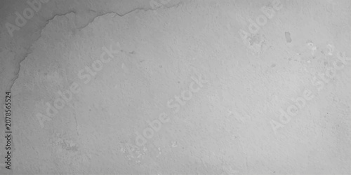Foto A close-up, grayscale shot reveals the subtle texture of water stains and subtle imperfections on a textured surface, hinting at aged material and the passage of time
