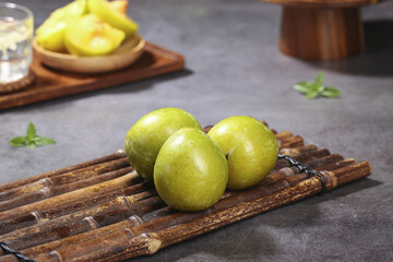 Fresh Yellow Plums on Bamboo Mat Kitchen Food Photography Studio Shot