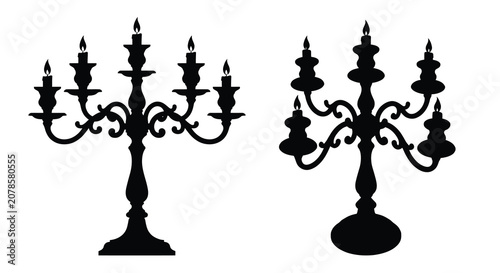 Фотография Elegant candelabra with five flames presented as a black silhouette candlestick