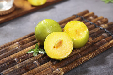 Fresh Yellow Flesh Plums on Bamboo Mat Studio Food Photography