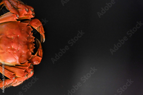 Tableau sur toile Cooked red crab on black background with copy space
