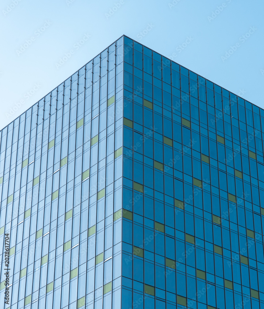 Fototapeta premium Modern Office Building Glass Curtain Wall Facade with Blue Windows