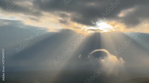 The Tyndall effect, or crepuscular rays, occur when sunlight penetrates gaps in clouds and is scattered by moisture or dust in the air, creating clear beams of light. These natural light and shadows, 