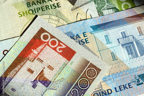 Close up background of Albanian lek banknotes, focusing on the 200 lek bill issued by the Bank of Albania 