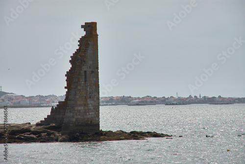 The ruins of the Tower of San Sadurnino rise above the sea on the islet of A Figueira, Cambados, Galicia