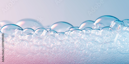 Pastel soap foam bubbles macro background, soft pastel pink and baby blue gradient background, crystal-clear glossy bubbles, for skincare and beauty concept