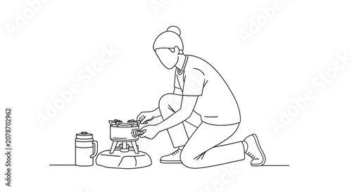 Person kneeling and working with tools on the ground.