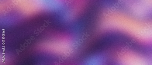 Abstract bokeh lights in purple and pink hues with subtle grain effect for a dreamy atmosphere