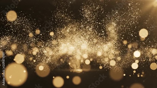 Abstract golden background with glowing particles and bokeh light effects.