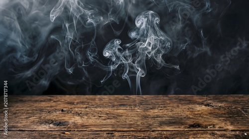 Dark smoke swirls above a wooden surface halloween atmosphere