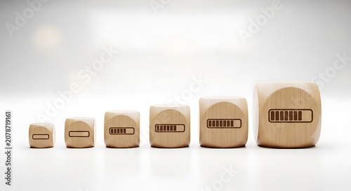 Wooden blocks with battery levels on a gradient white background