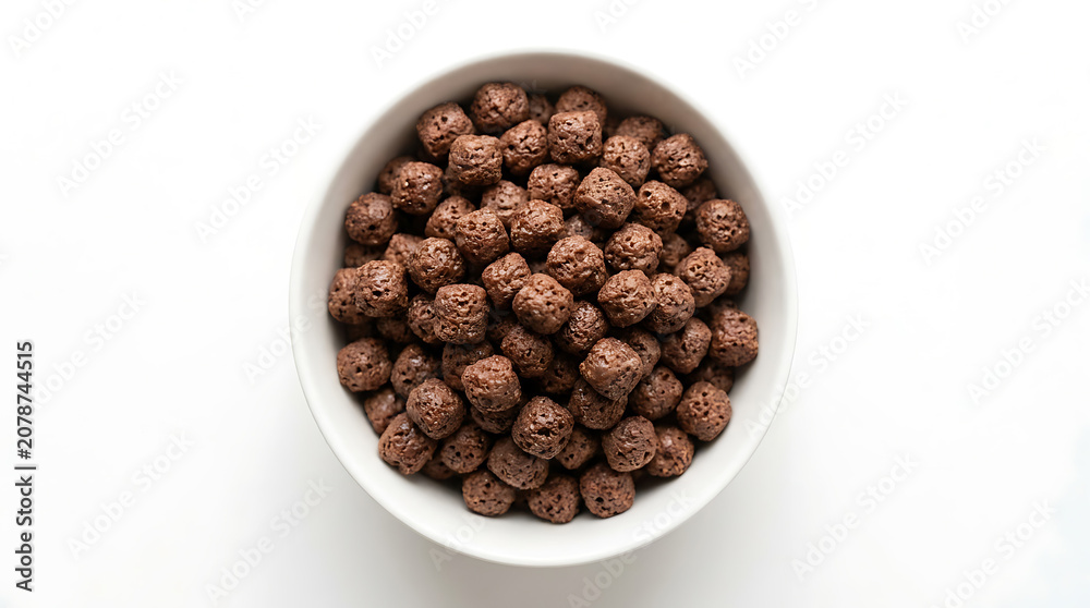 Fototapeta premium Chocolate Cereal Balls In White Bowl Top View Healthy Breakfast Snack Food Concept