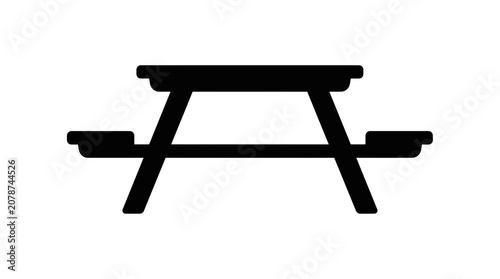 Silhouette of a classic wooden picnic table with benches