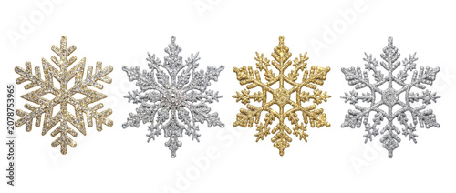 Four distinct snowflakes show unique shapes and colors. Each snowflake has a clear background and is suitable for holiday decoration